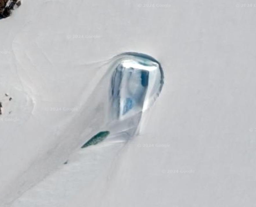 Rectangular shape in the barren snowy wastes of Antarctica, speculated to be a secret gateway by conspiracy theorists